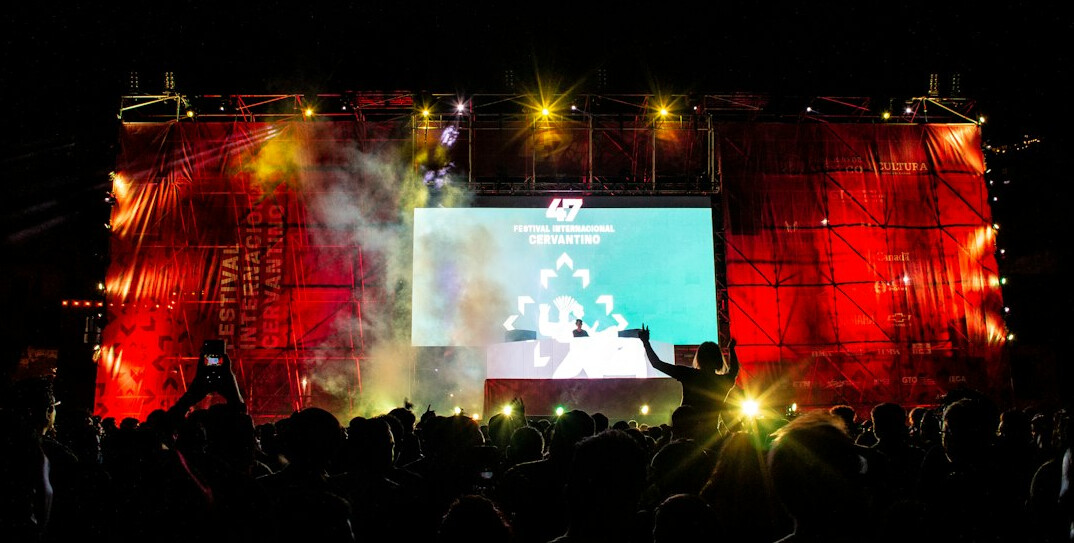 Live event stage with lighting and screens